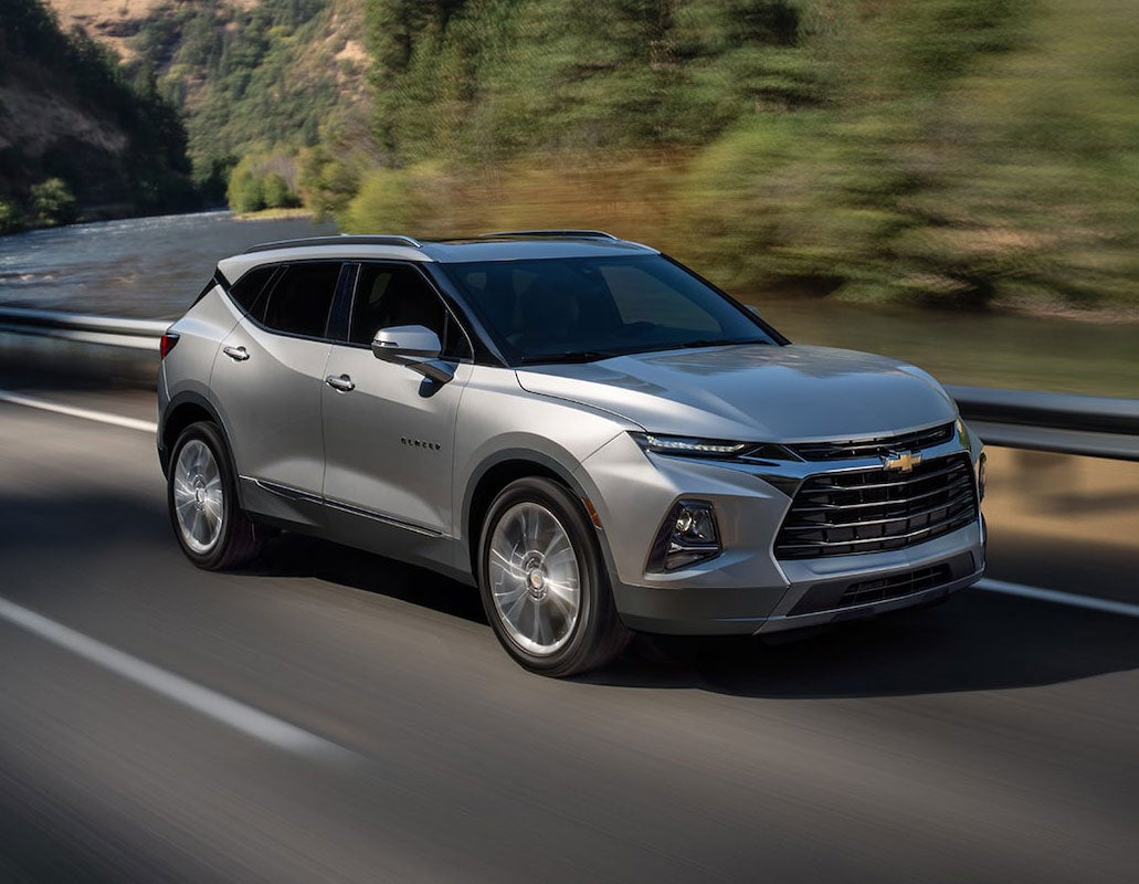 silver chevrolet on road